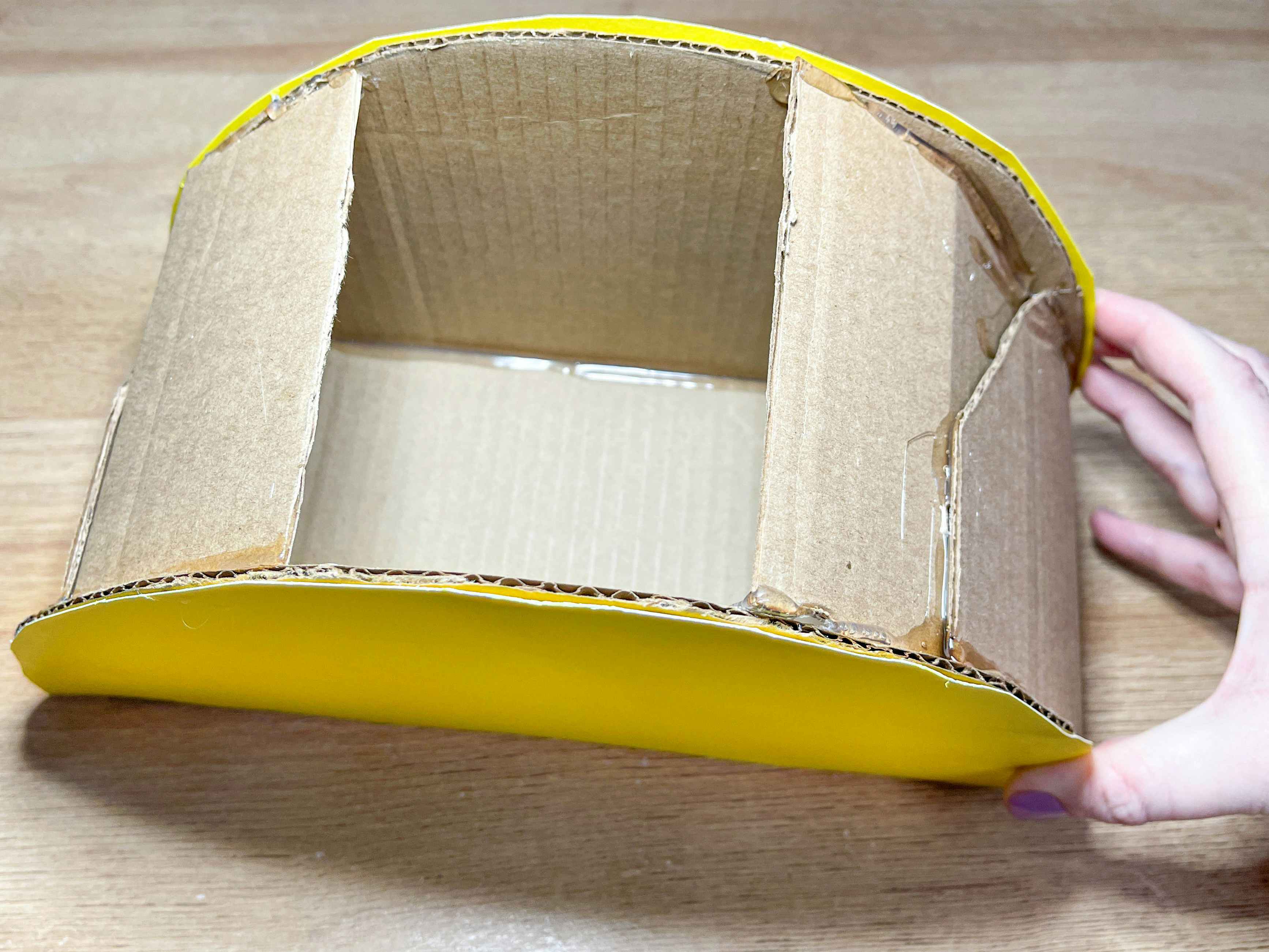 two images of a diy cardboard taco box 