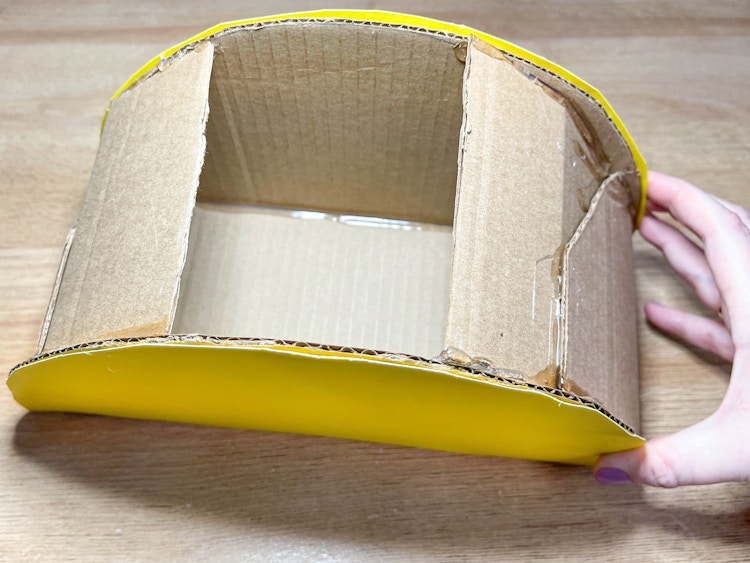 two images of a diy cardboard taco box 