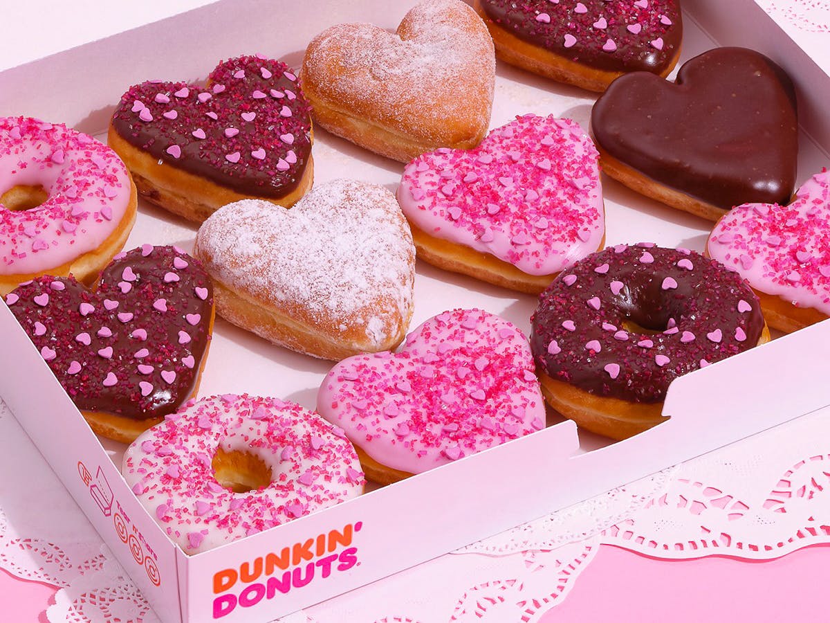 Some heart-shaped doughnuts in a Dunkin Donuts box
