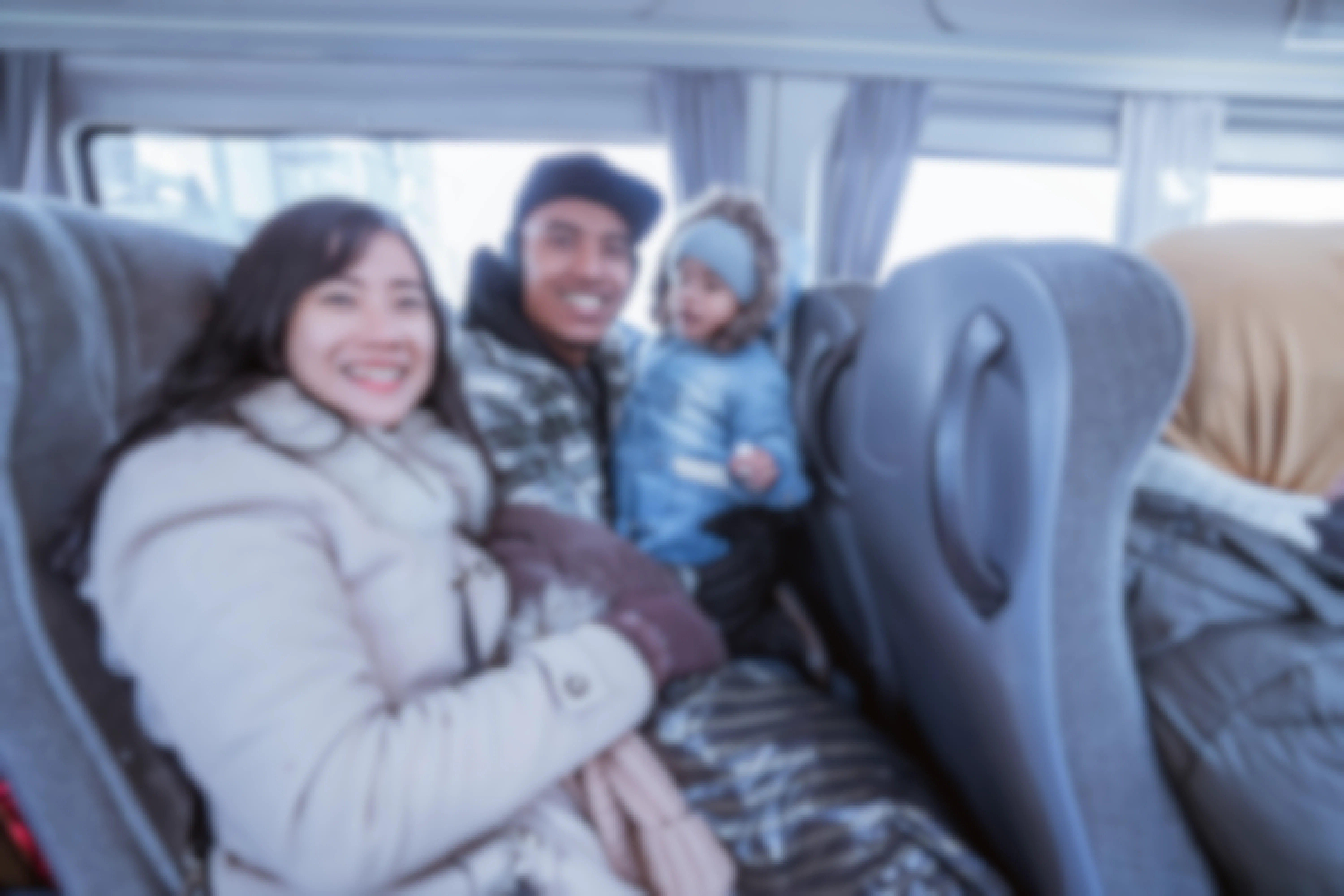 Family with child riding the bus