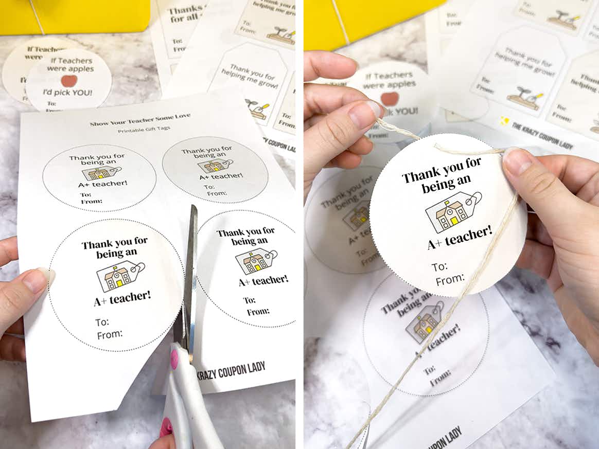 Someone cutting out one of KCL's free printable teacher gift tags and stringing a piece of string through a hole made at the top of one
