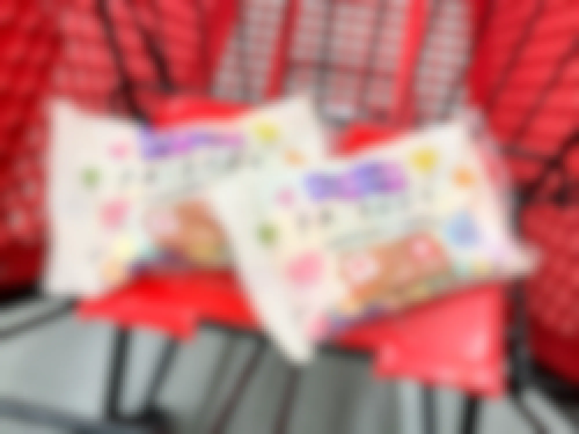 packages of brachs friends-themed conversation hearts in target cart