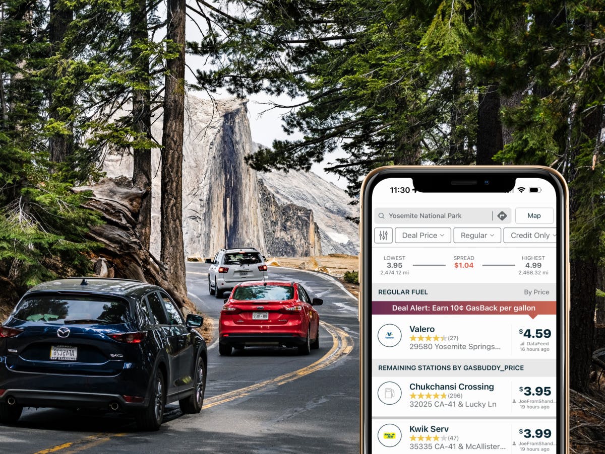 A view of cars driving up the main road to Yosemite National Park, with a smartphone in the right corner showing the GasBuddy app listings of the cheapest gas prices in the Yosemite area.