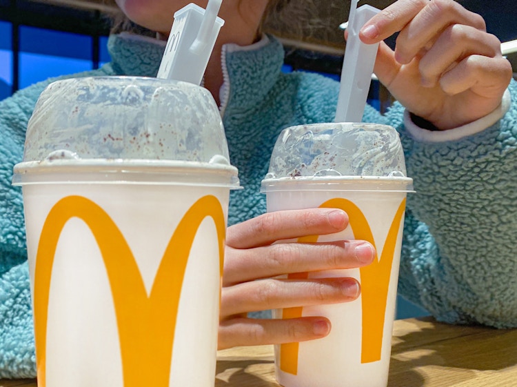 person eating mcdonalds mcflurry in restaurant