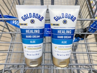 Two Gold Bond Healing Hand Creams sitting in a store cart.