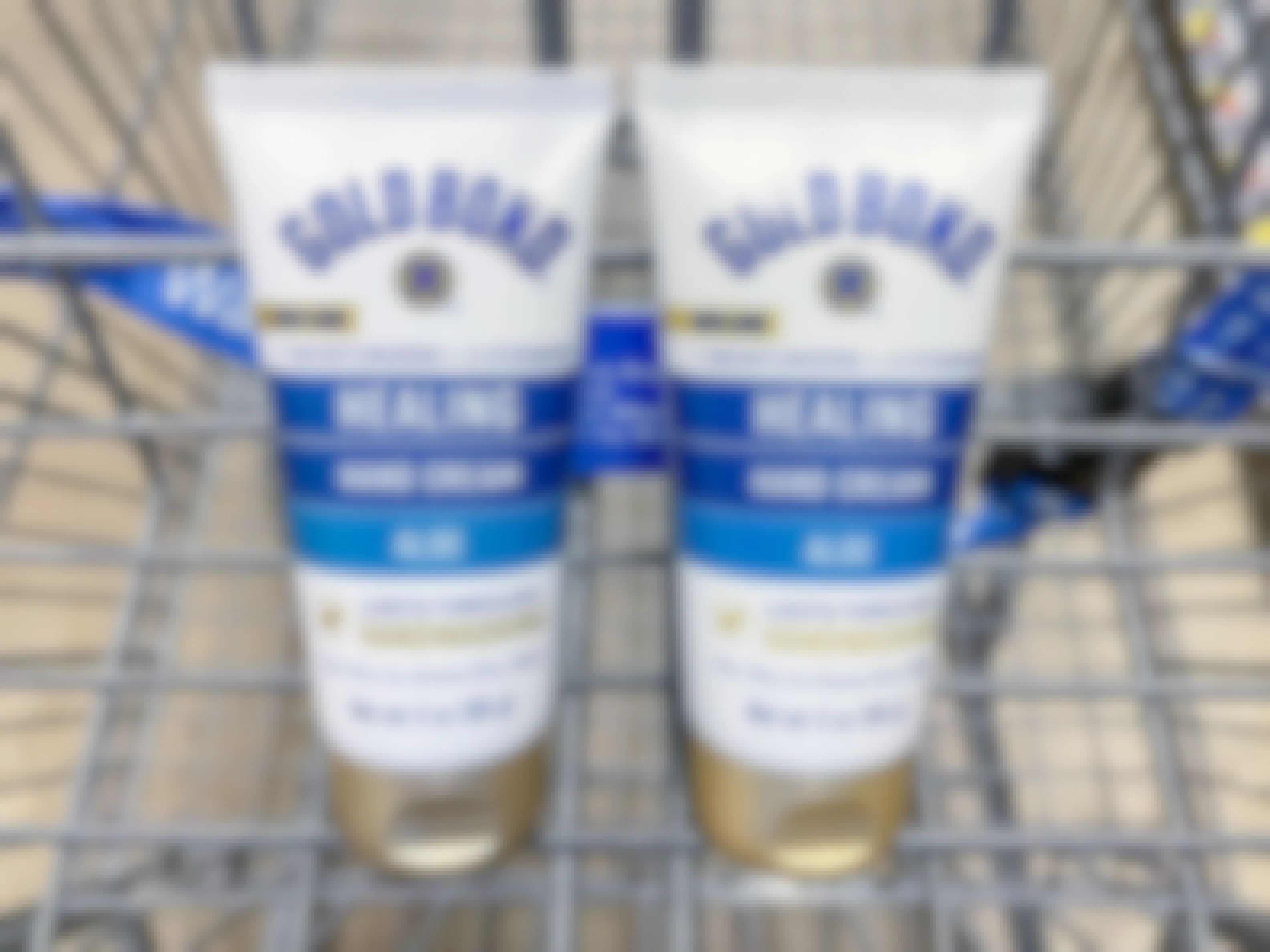 Two Gold Bond Healing Hand Creams sitting in a store cart.