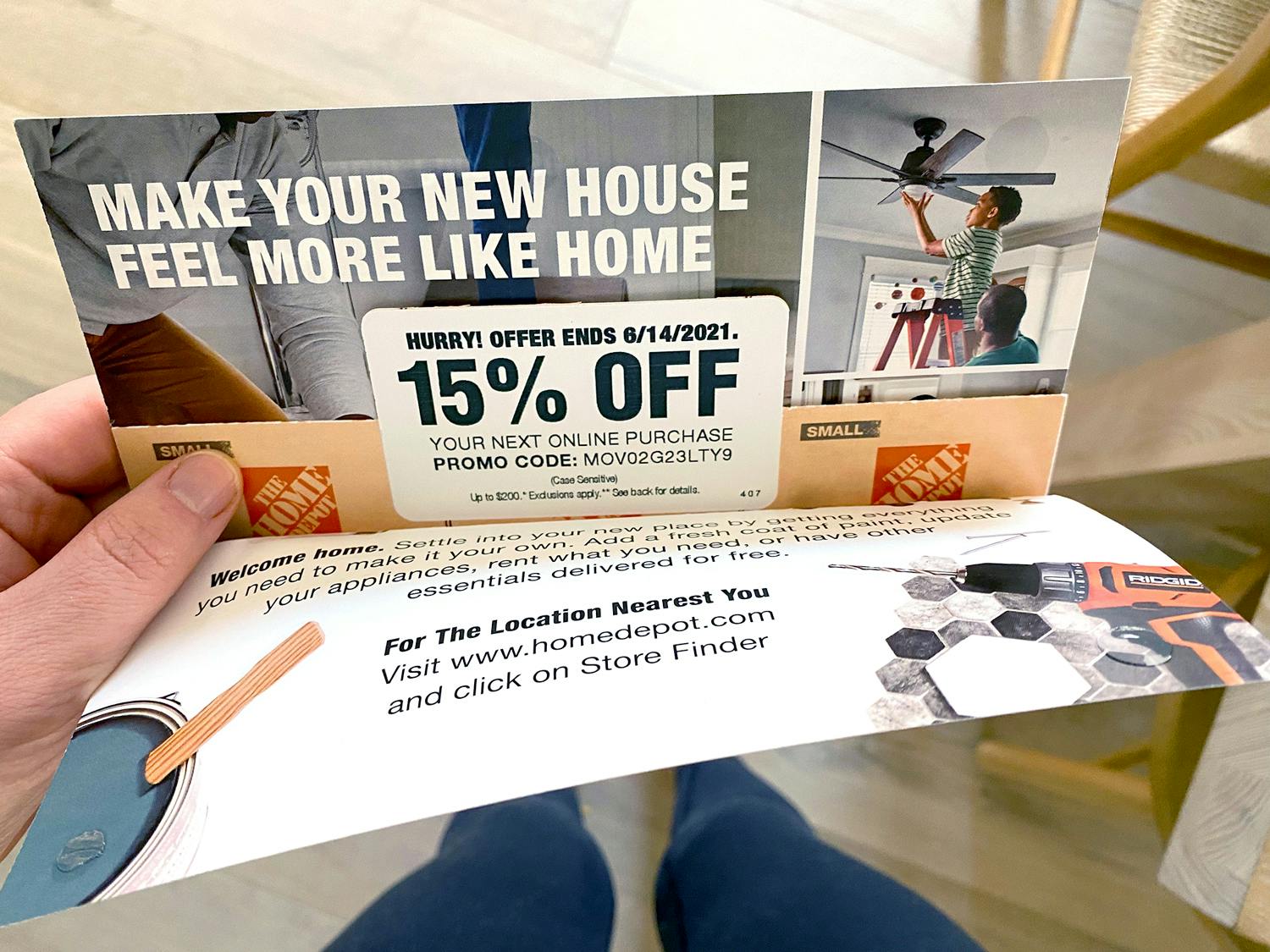 person holding old discontinued home depot moving coupon