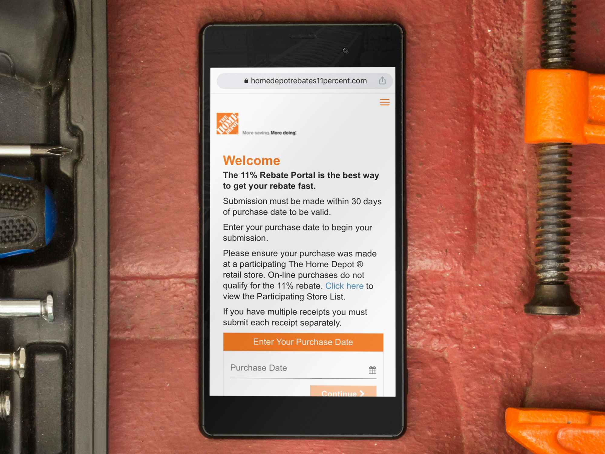 phone with screenshot of home depot 11% rebate portal