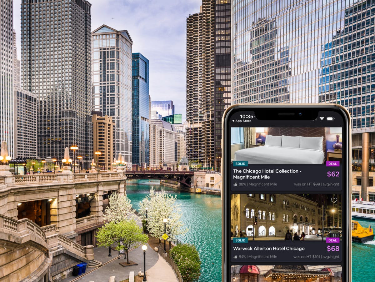 A view of the Chicago river with a smartphone infront of it showing hotel listings on HotelTonight for under $100
