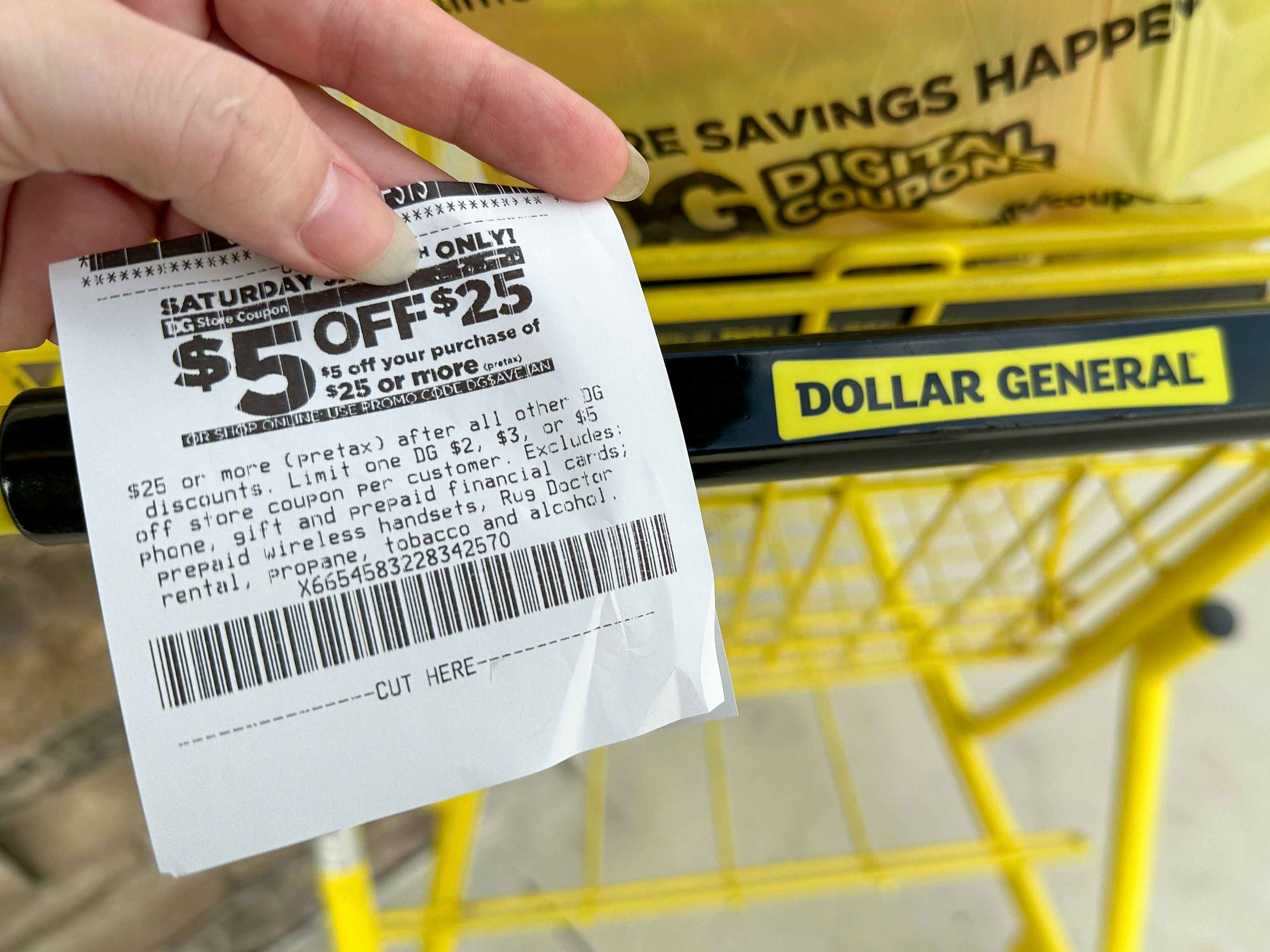 Someone holding a $5 off of $25 coupon on a receipt at Dollar General