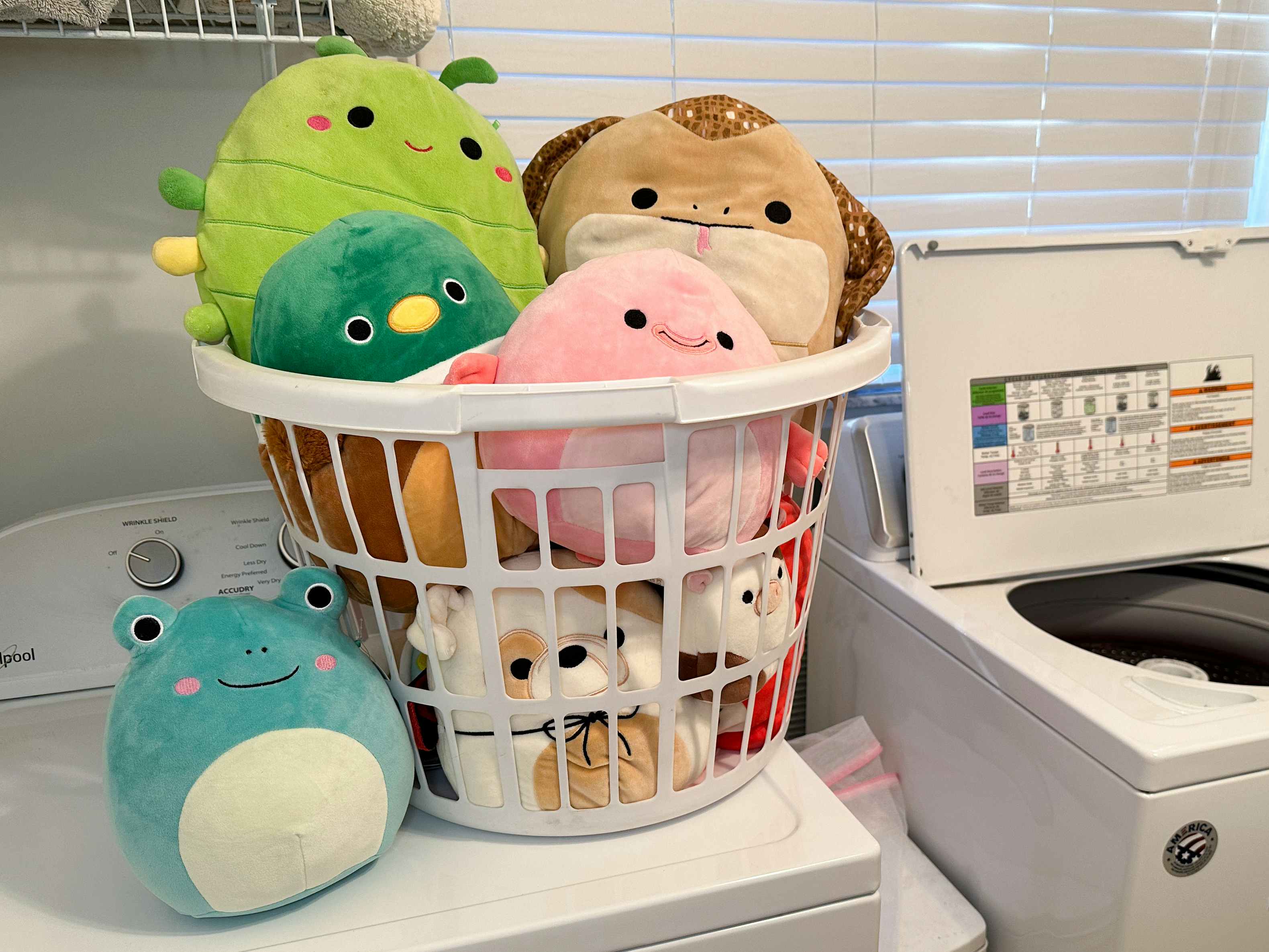 A laundry basket of Squishmallows waiting to be washed