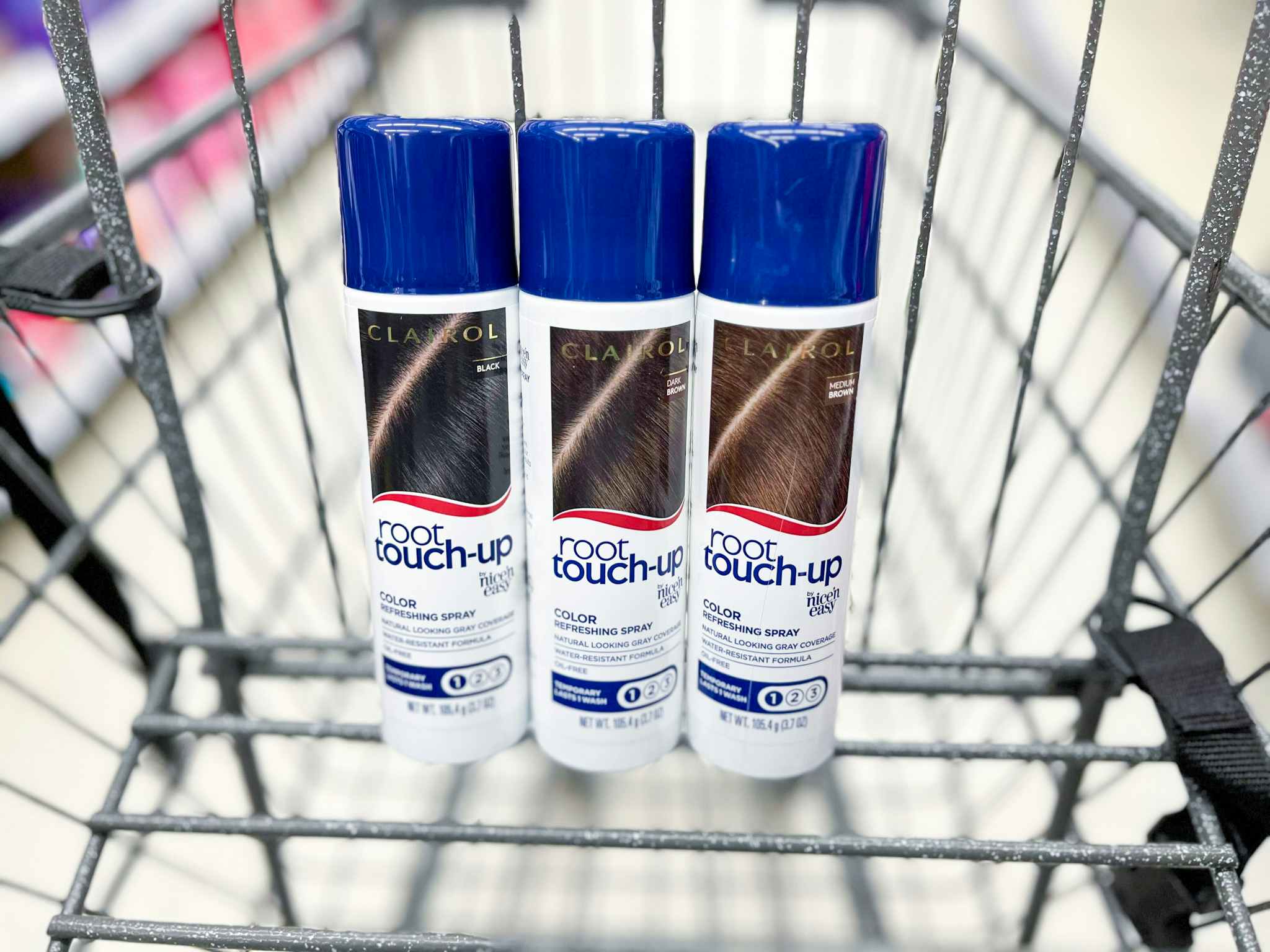 three cans of clairol hair color in basket