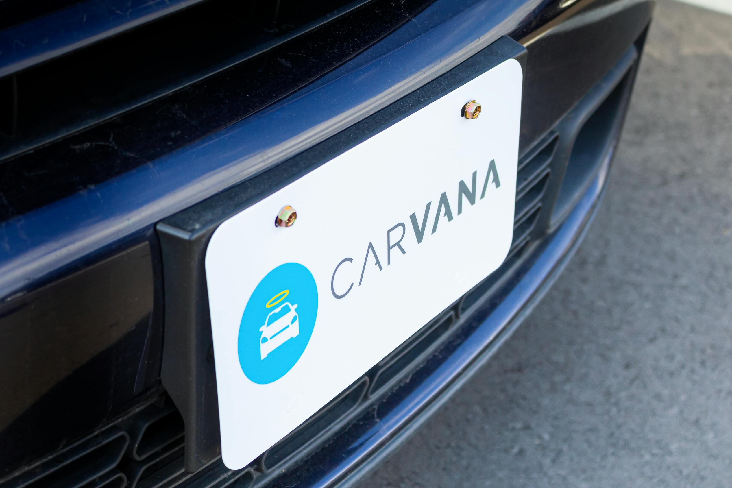 A Carvana branded front license plate on a vehicle