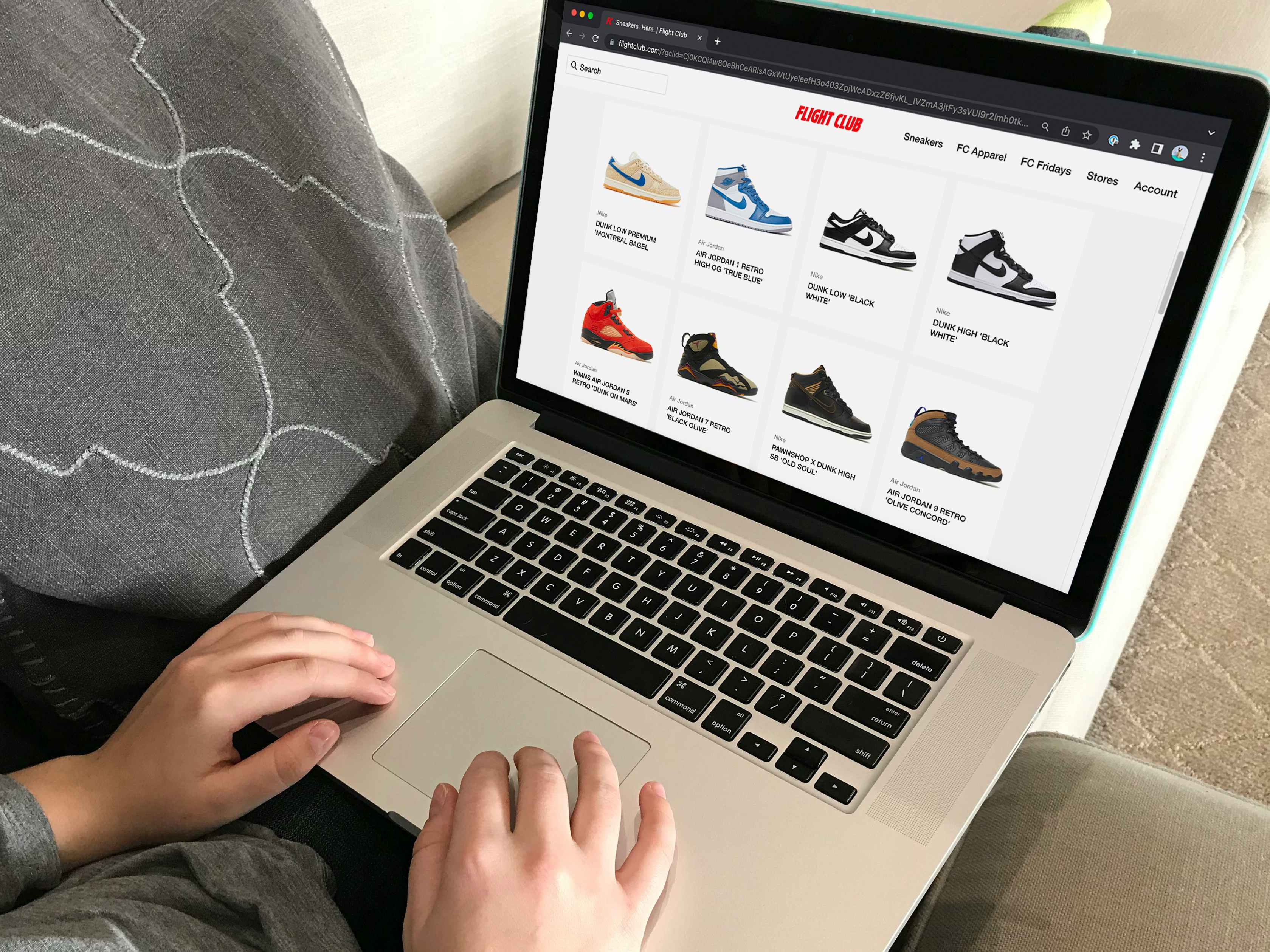 A person looking at the selection of sneakers on the Flight Club website