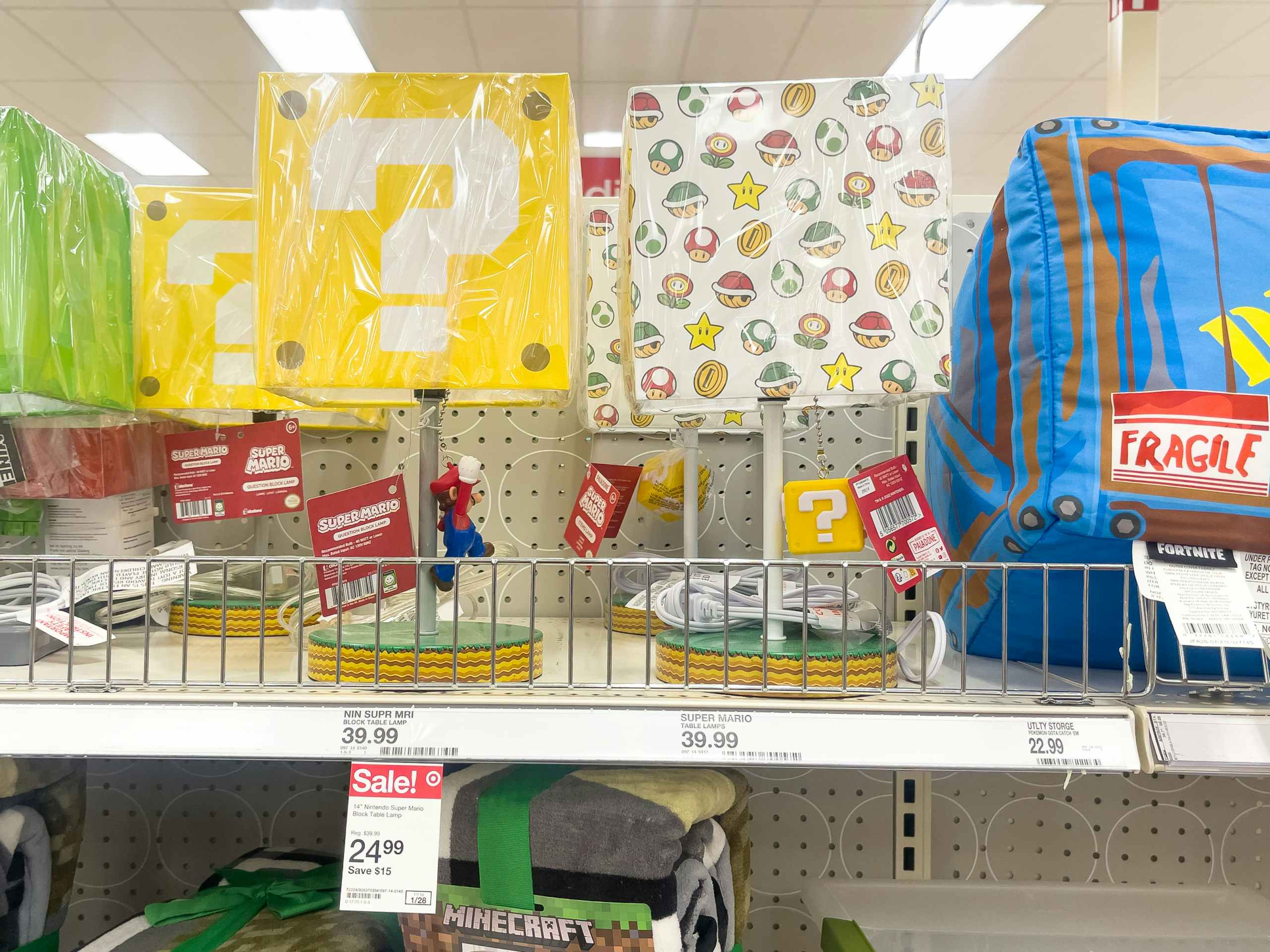 A variety of kid lamps sitting on a store shelf.