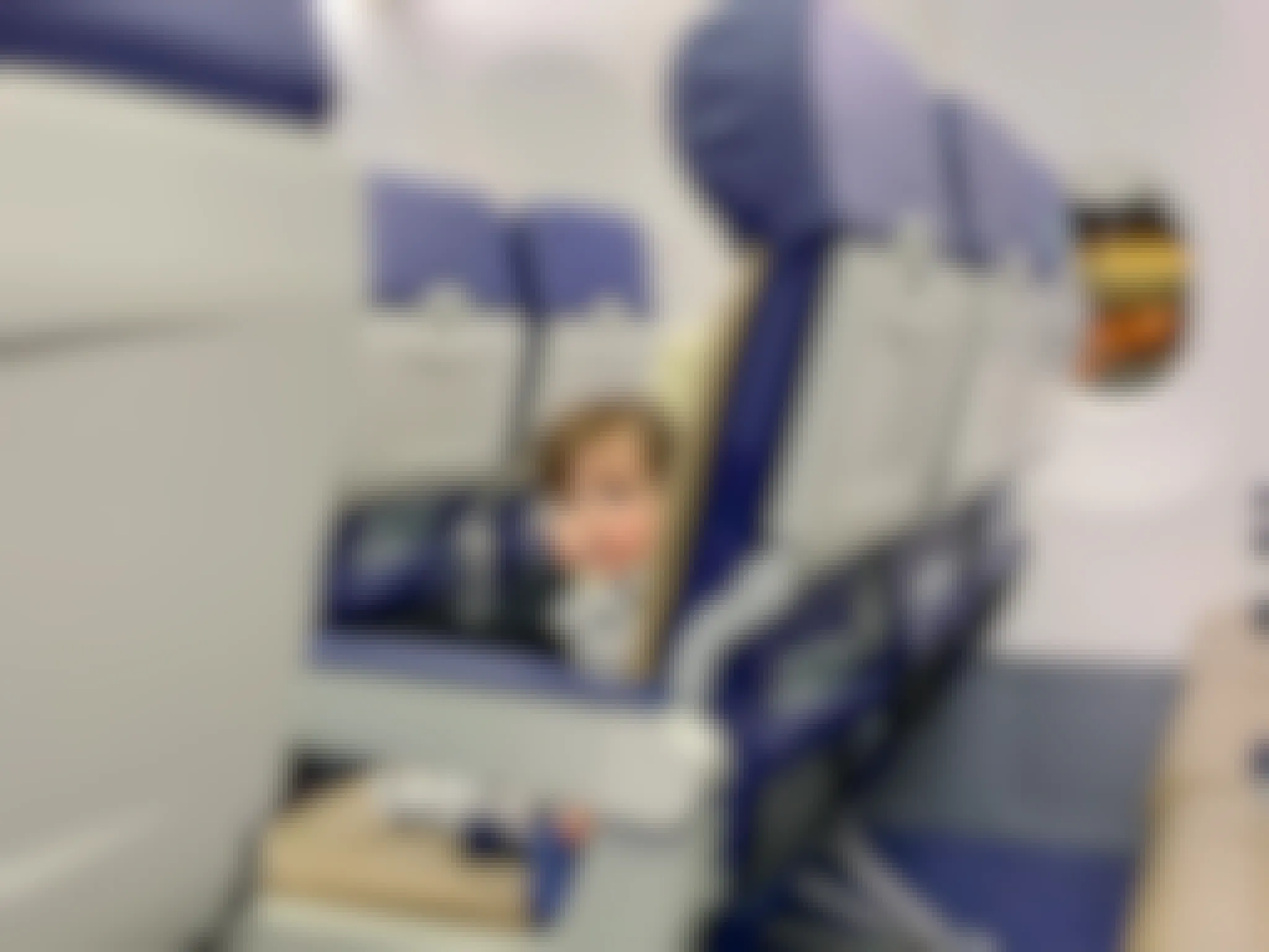 a baby sitting in a seat on an airplane