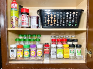 spice rack organized in a cabinet