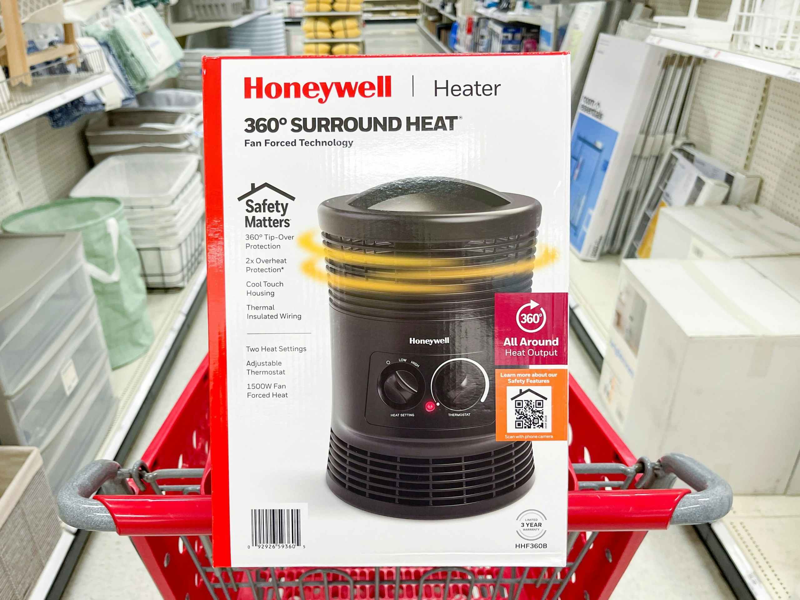 A Honeywell heater sitting in a shopping cart.