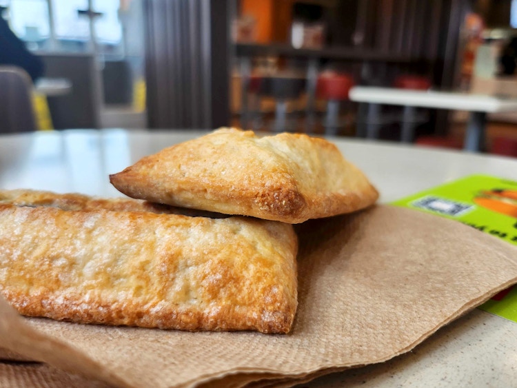 two mcdonalds pies stacked on top of each other on a napkin