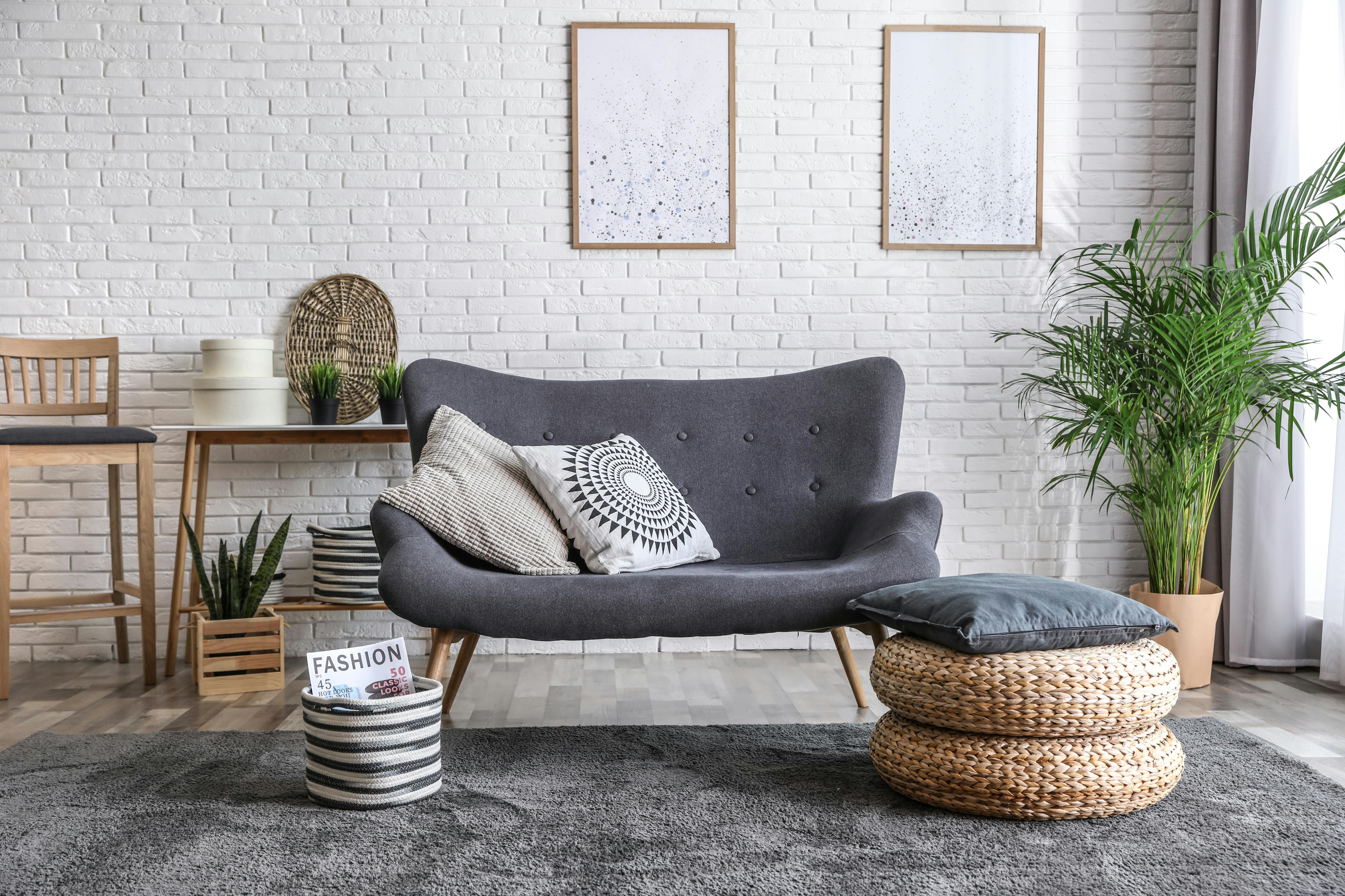a stylish living room with modern furniture and boho decor