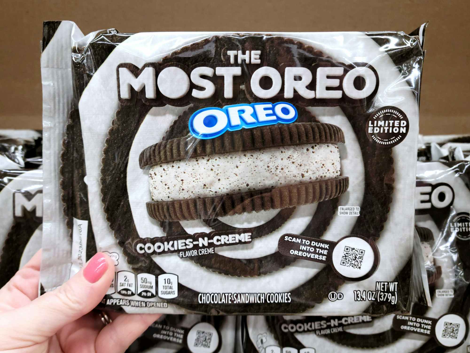 hand holding the most oreo package