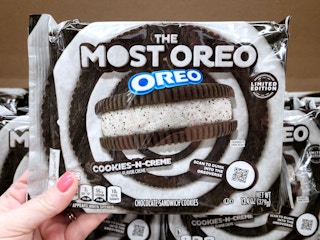 hand holding the most oreo package