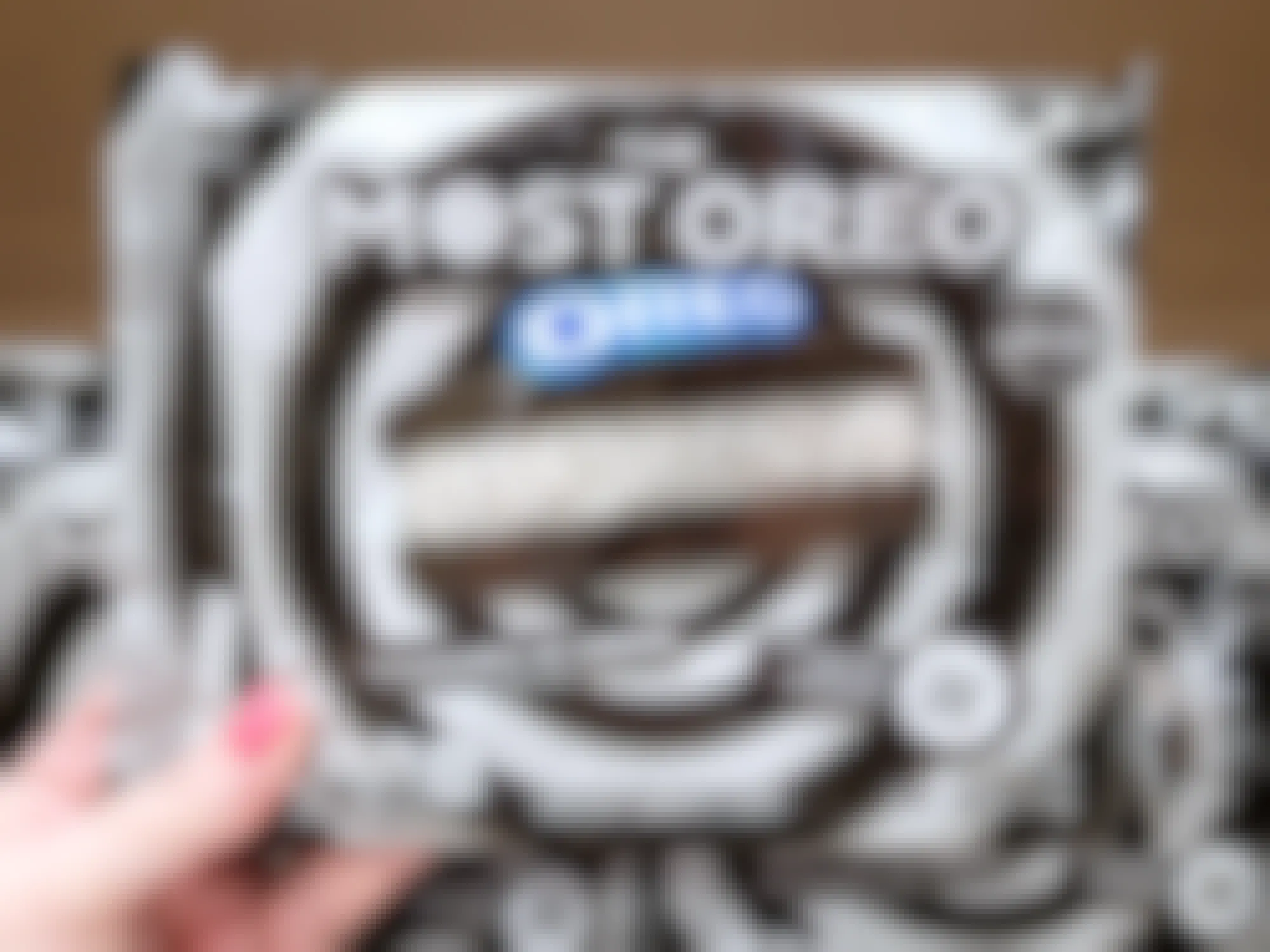 hand holding the most oreo package