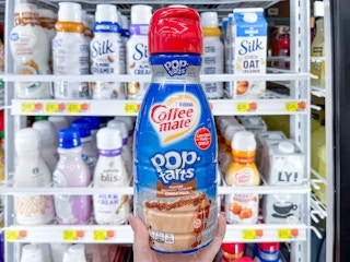 hand holding coffee mate new pop tarts creamer near walmart cooler
