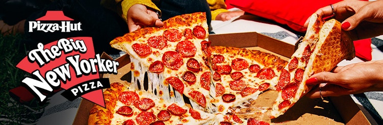 Pizza Hut Big New Yorker Pizza ad wtih people reaching for the pizza slices.