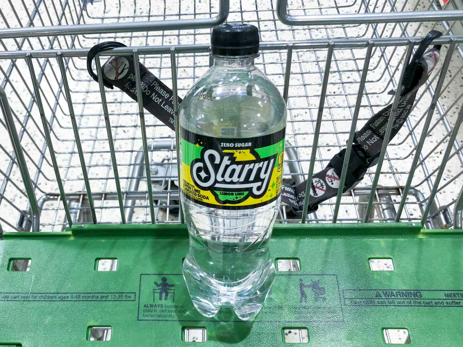 A bottle of Starry lemon lime soda in a grocery cart