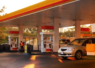 Shell Gas station with a car parked at one of the gas pumps