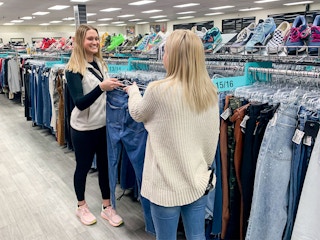 Person talking to plato's closet store associate