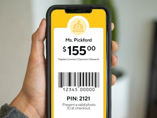 person holding phone with staples classroom rewards screenshot