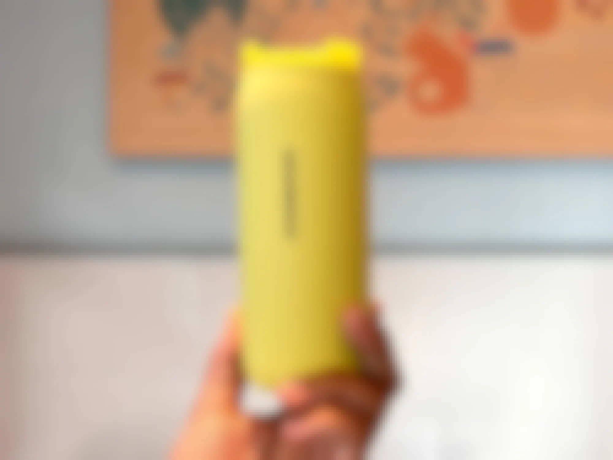 holding starbucks spring 2023 canary yellow tumbler in store