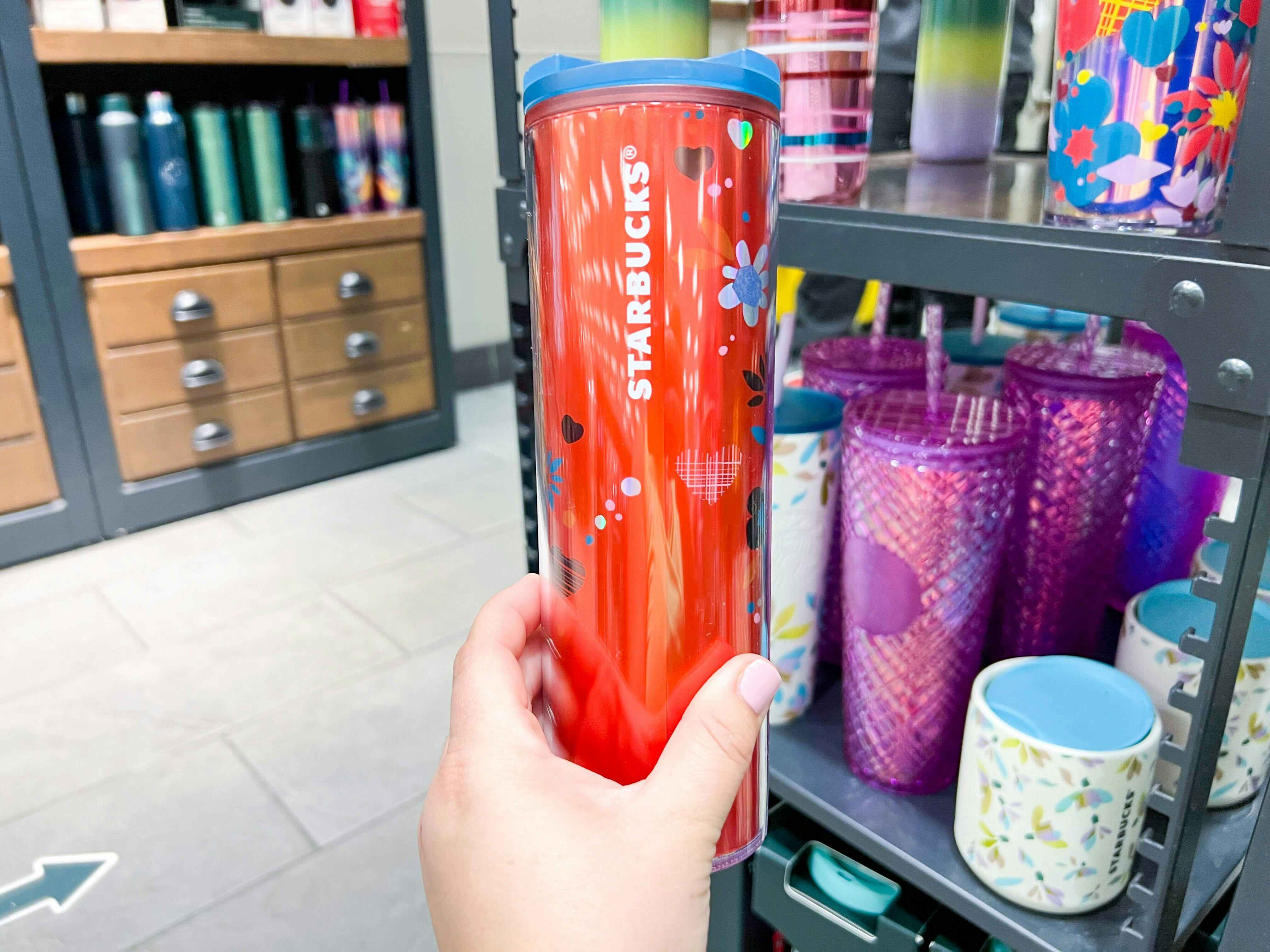 starbucks love confetti tumbler red being held 