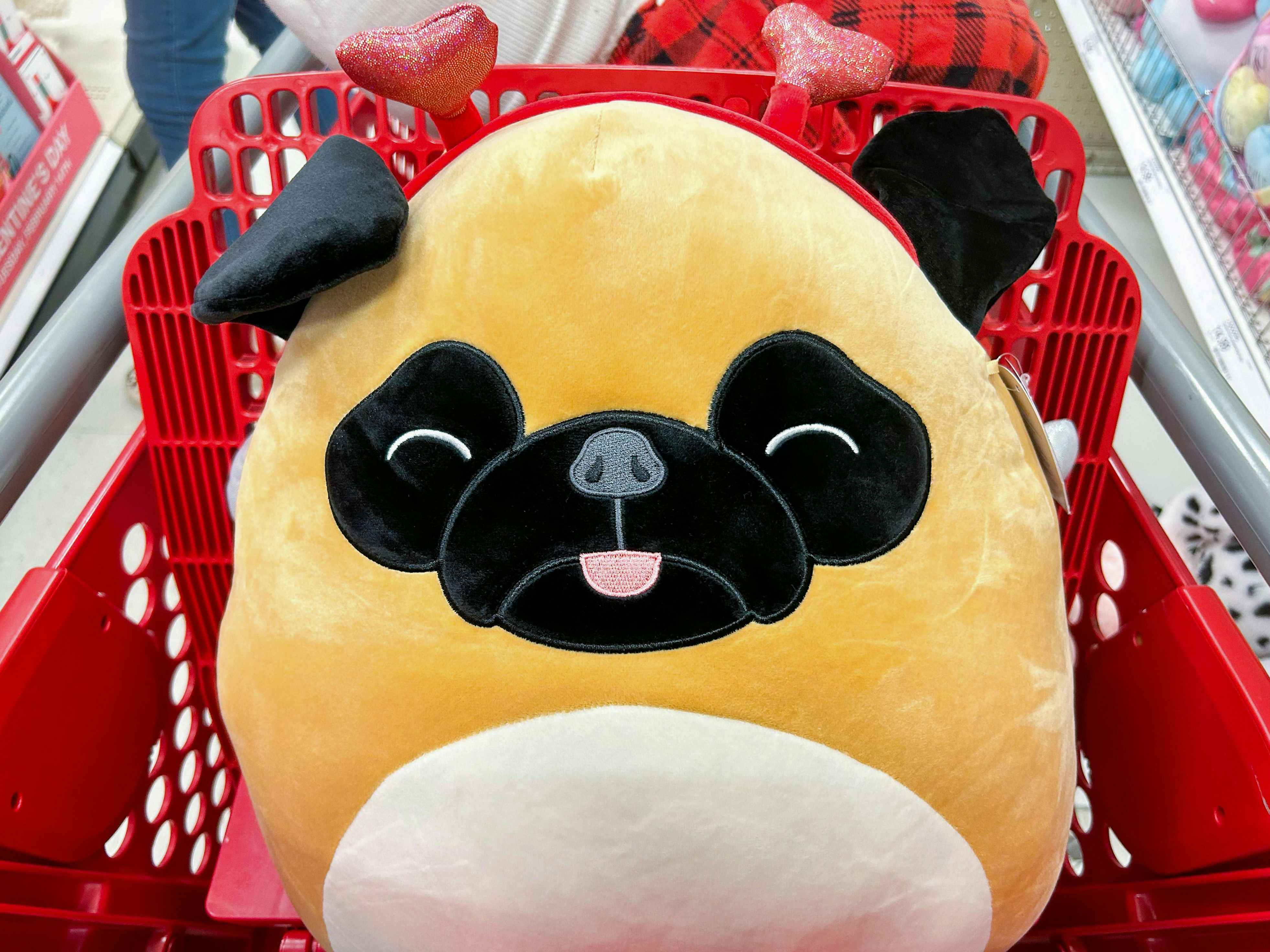 A Valentine's Day Pam Pug Squishmallow in a Target Cart