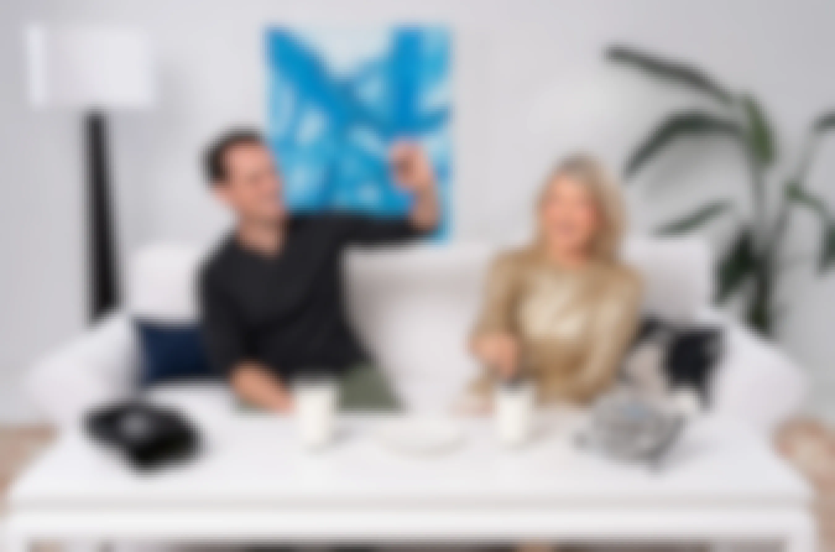 Martha Stewart and Ryan McCallister sitting on a couch with a The Most OREO OREO package and a VR headset.