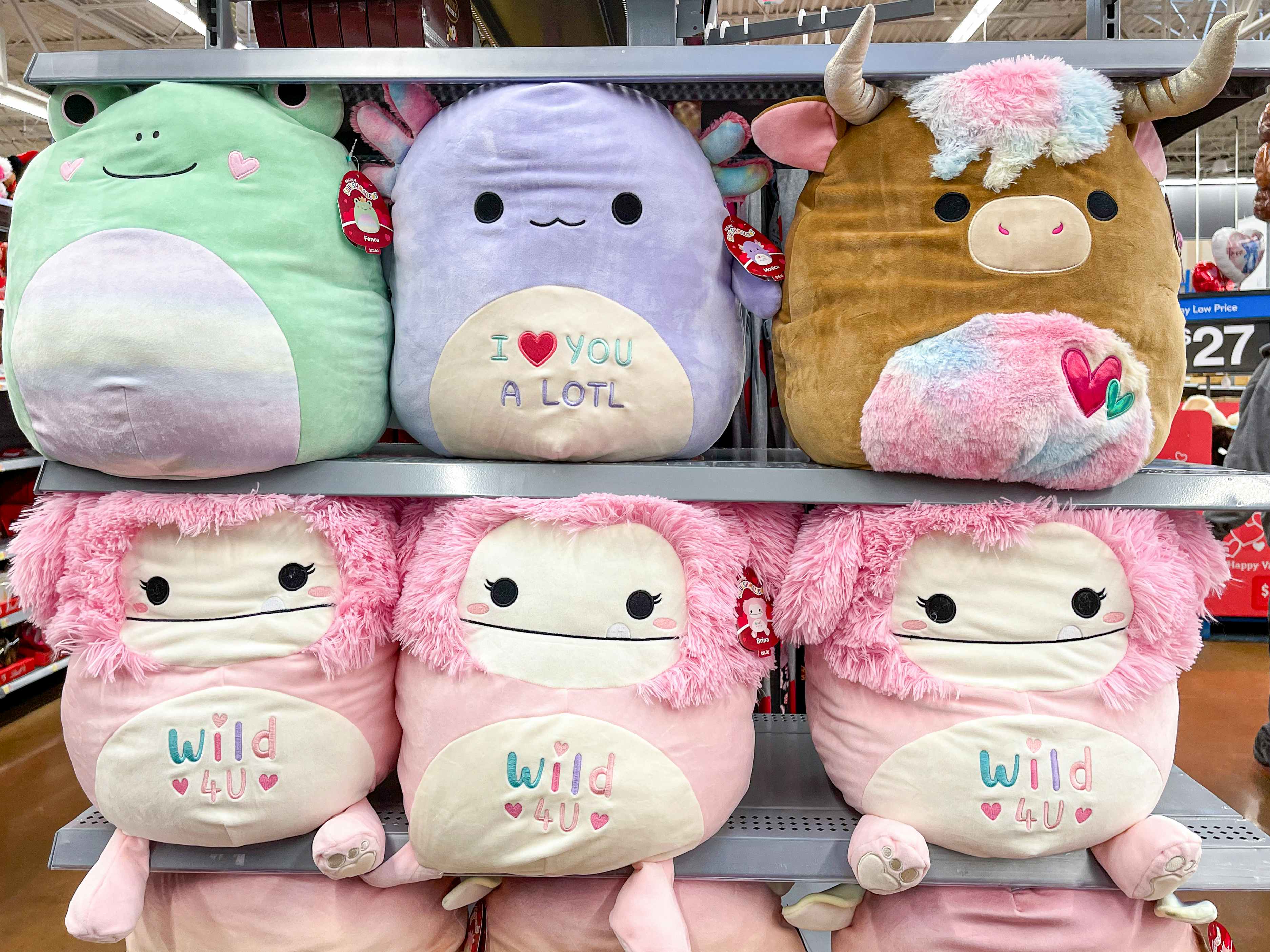 Large Valentine's Day Squishmallows on a shelf at Walmart