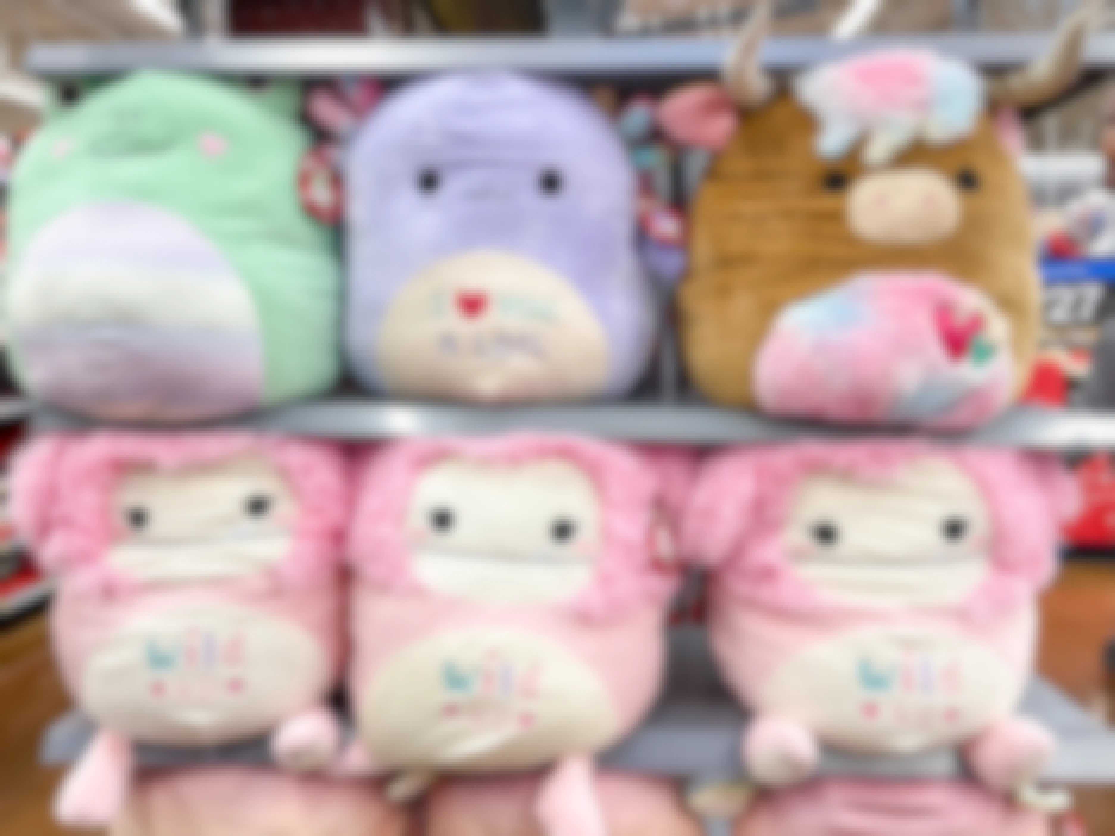 Large Valentine's Day Squishmallows on a shelf at Walmart