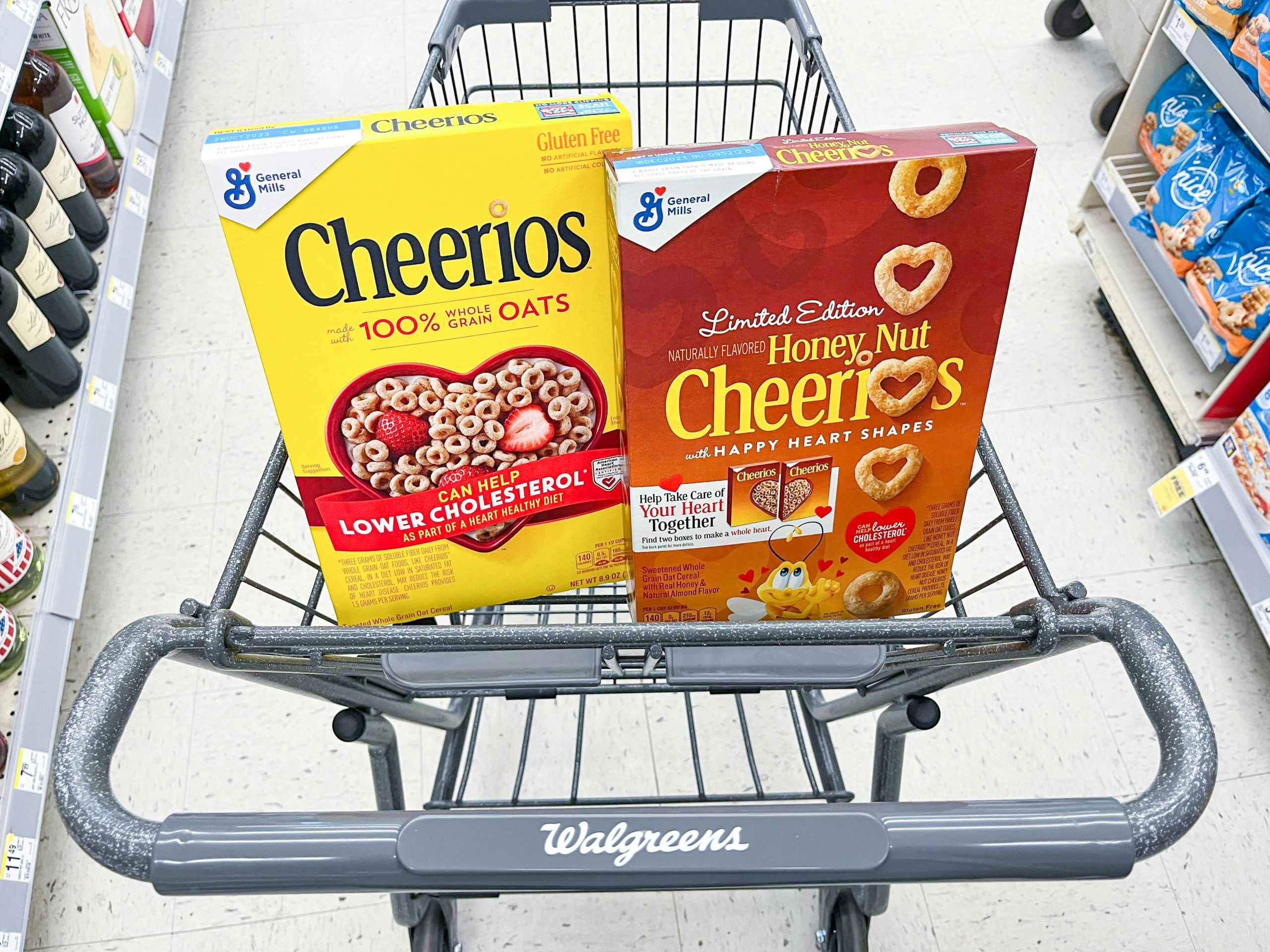 shopping cart with two boxes of General Mills Cheerios cereal inside