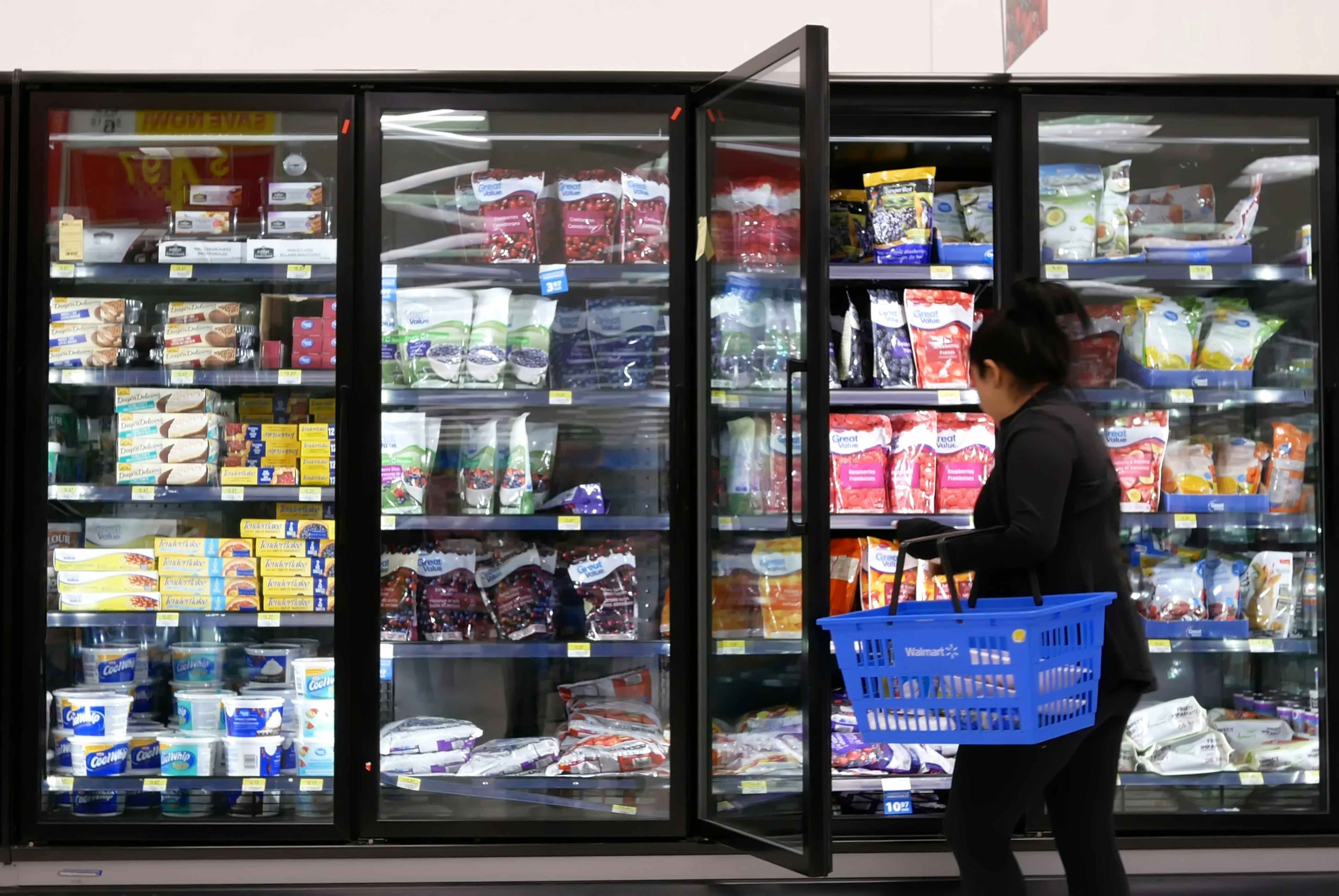 Shopper in the frozen section at walmart