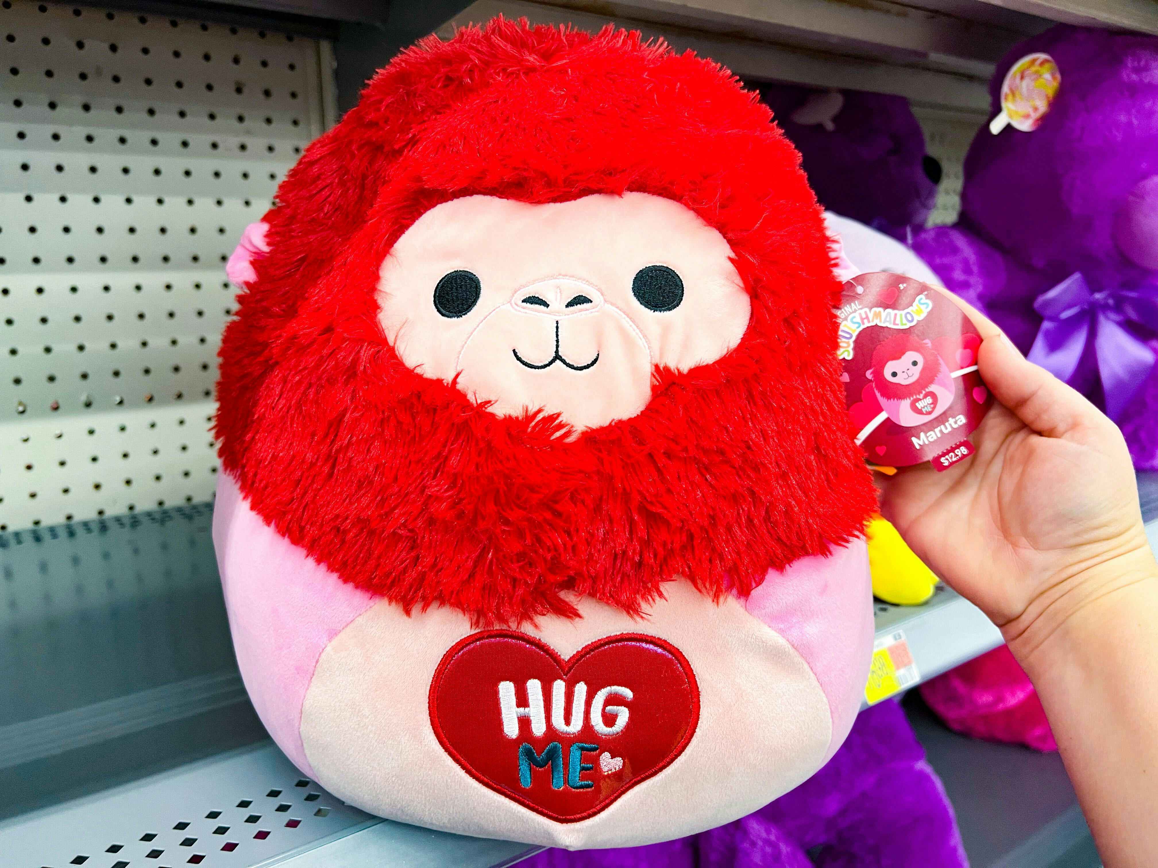 A Valentine's Day Maruta Squishmallow with a heart that says "Hug Me