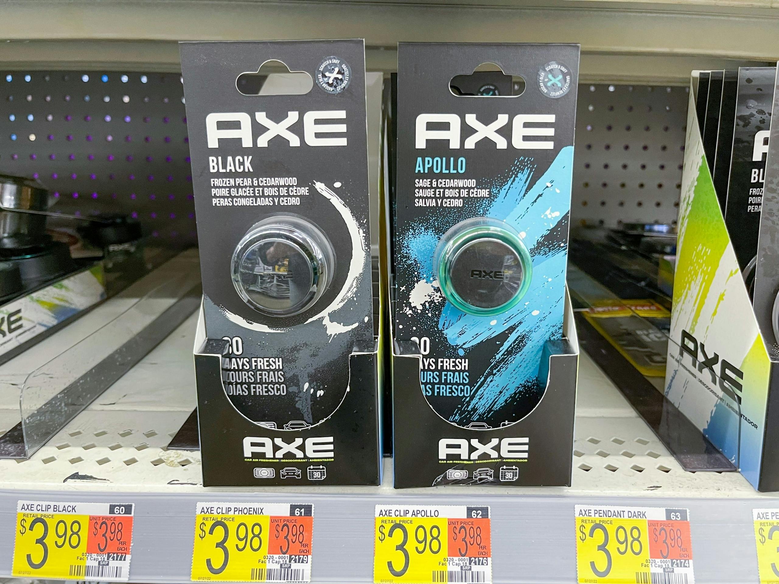 Axe car fresheners sitting on a store cart.