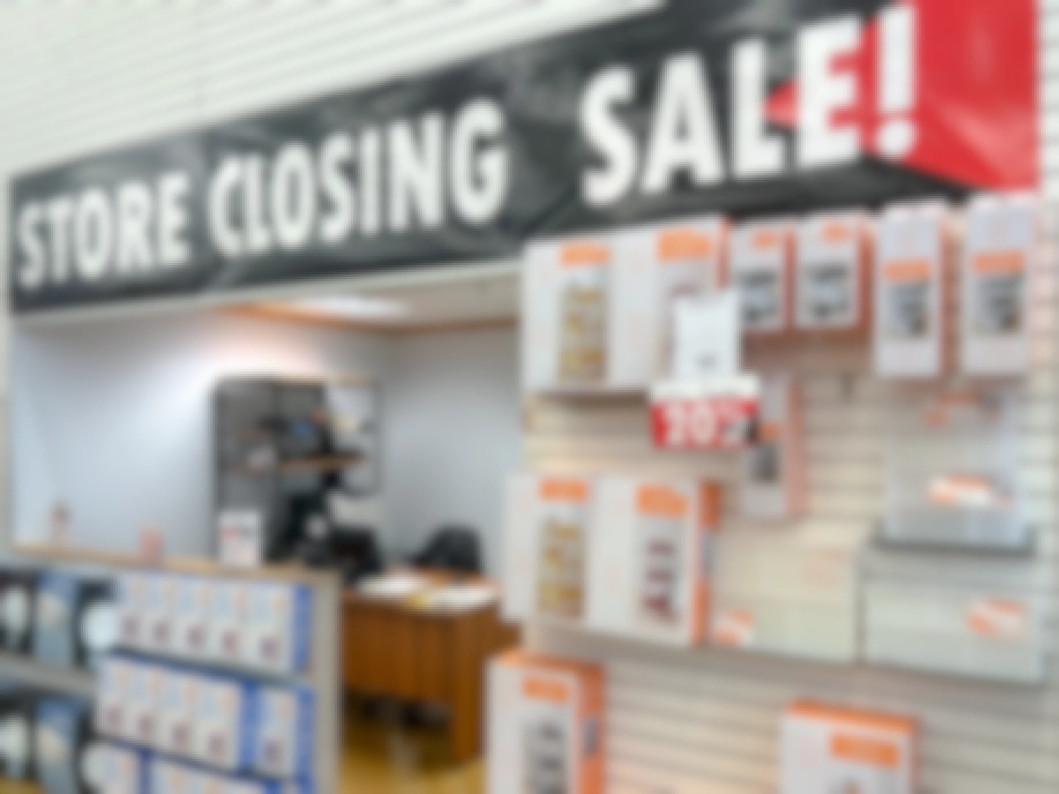 utility storage clearance at closing bed bath and beyond store with banner