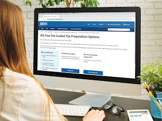 person looking at irs free tax filing webpage on computer