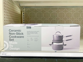 A ceramic non-stick cookware set sitting on a store shelf.