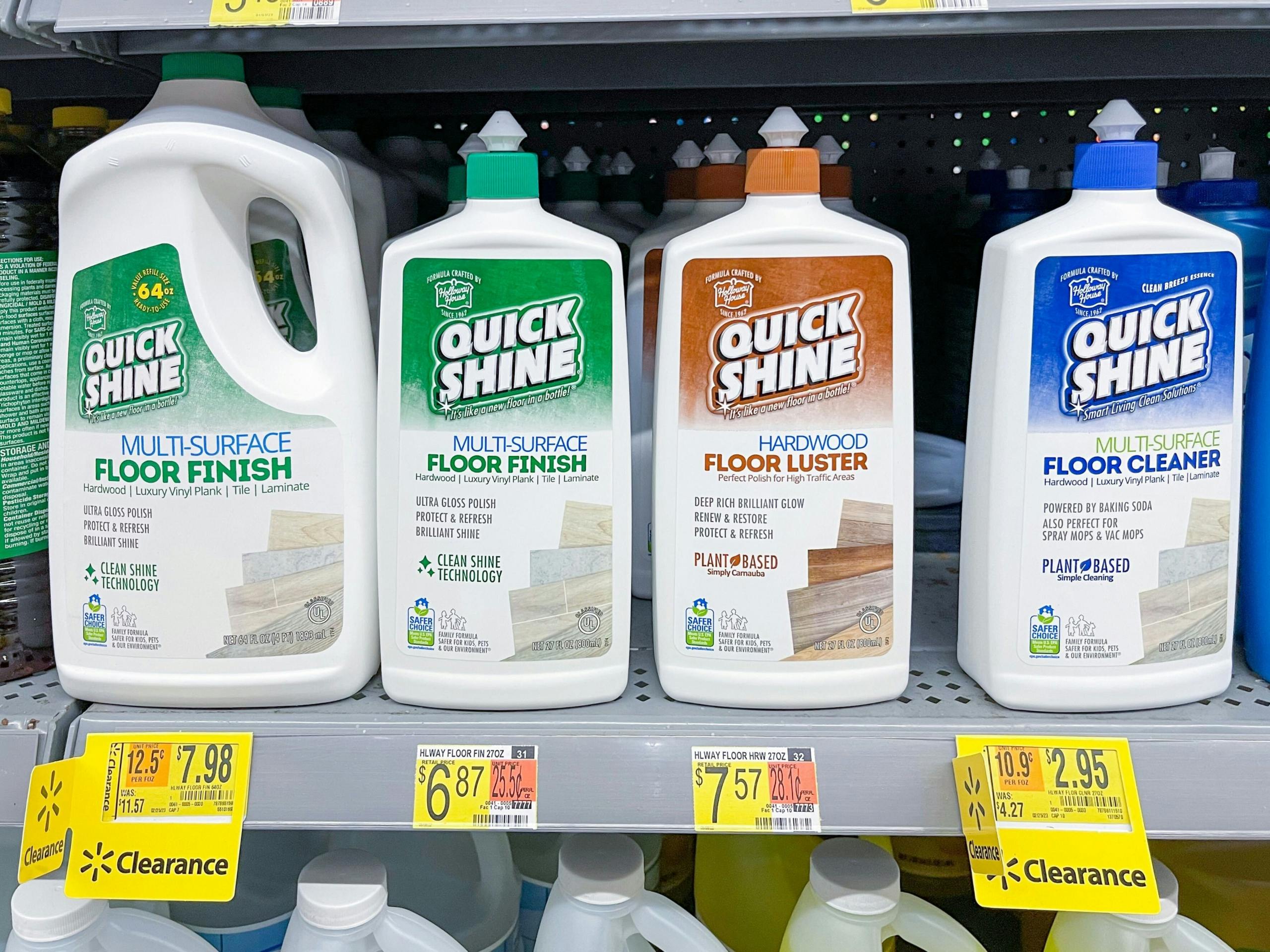 A variety of cleaning supplies sitting on a store shelf with clearance stickers and price stickers on the shelf.