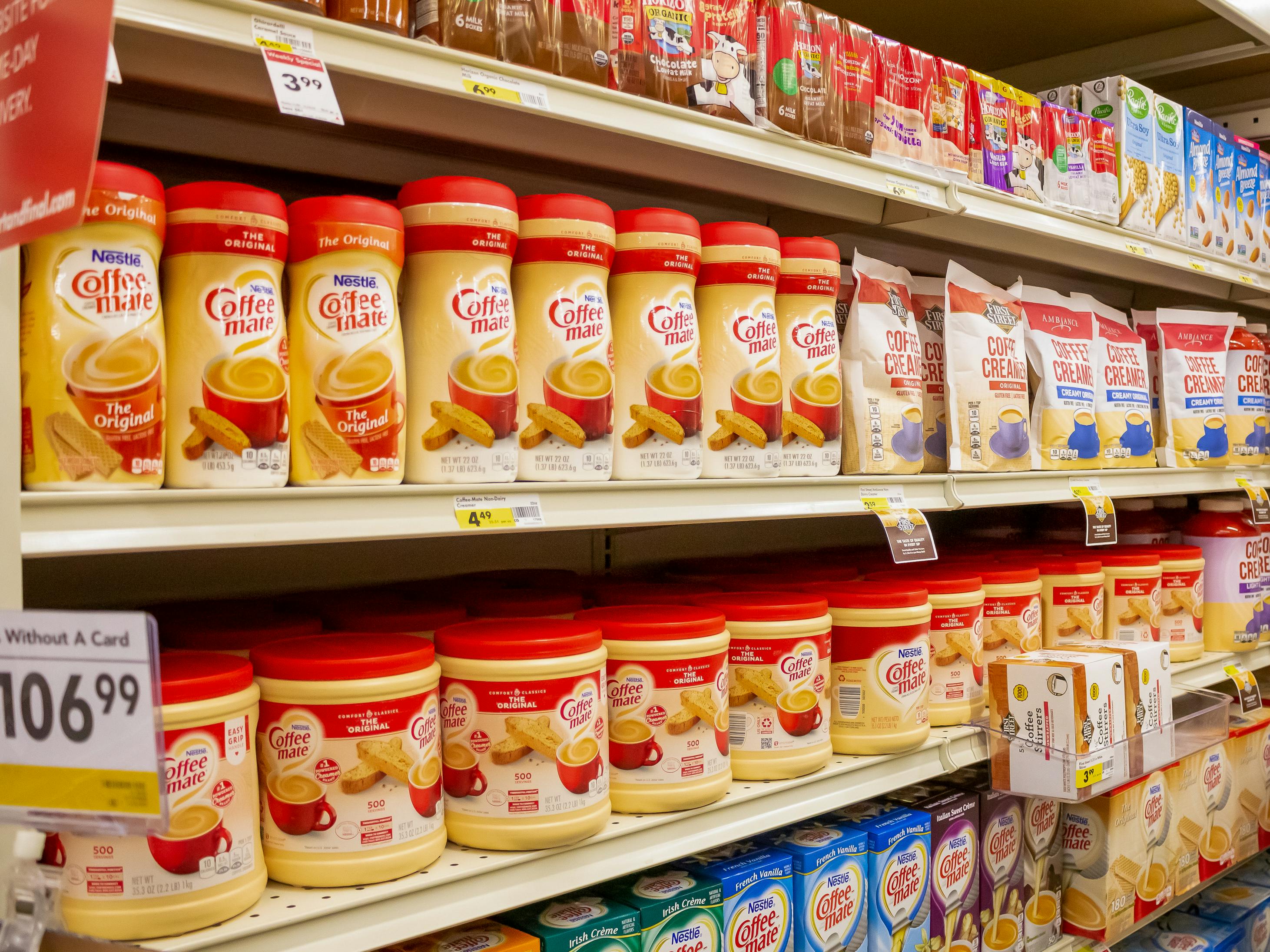 Shelves of Coffee Mate powder creamers in a store