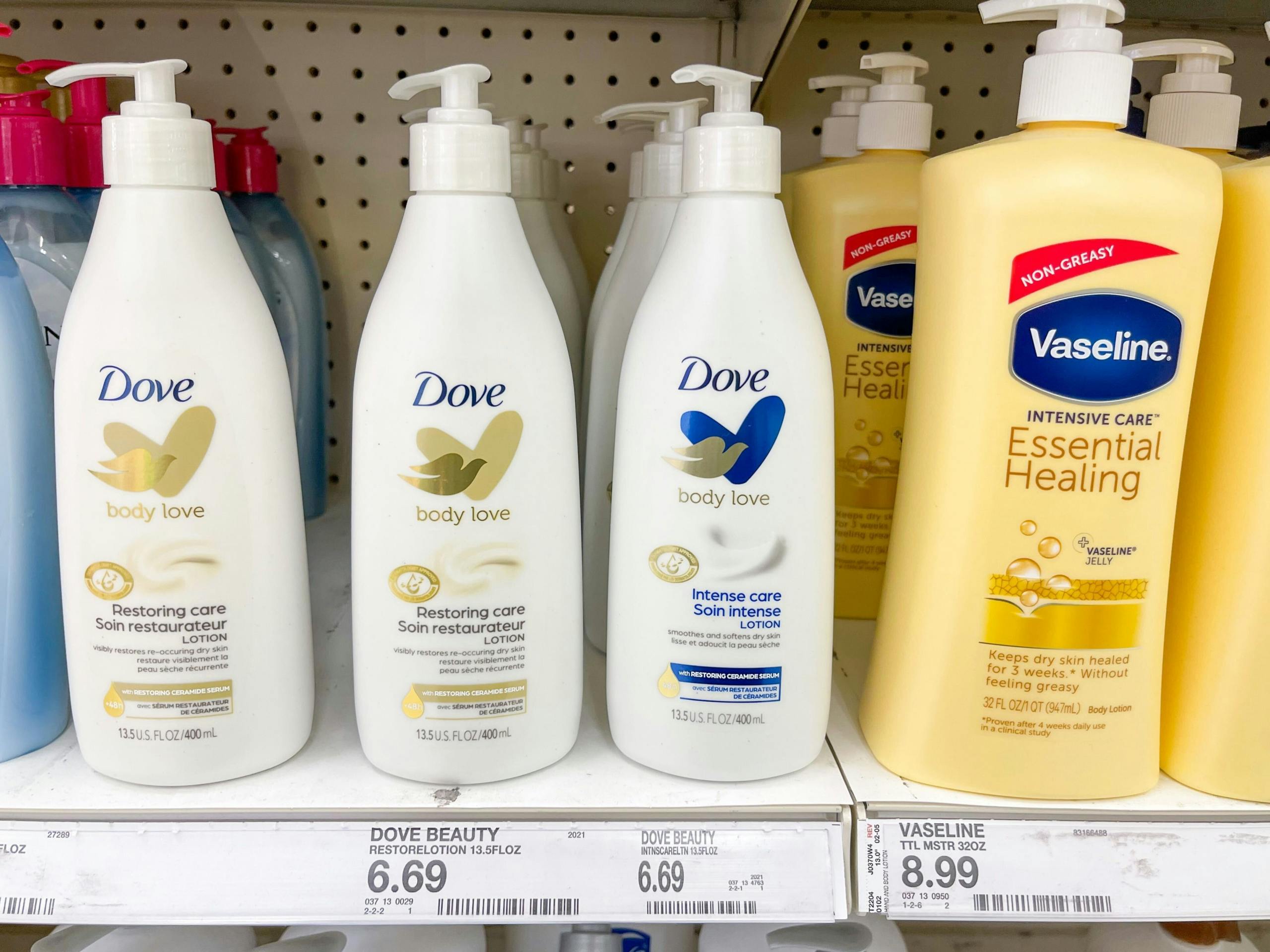 Dove Body Love Lotion sitting on a store shelf.