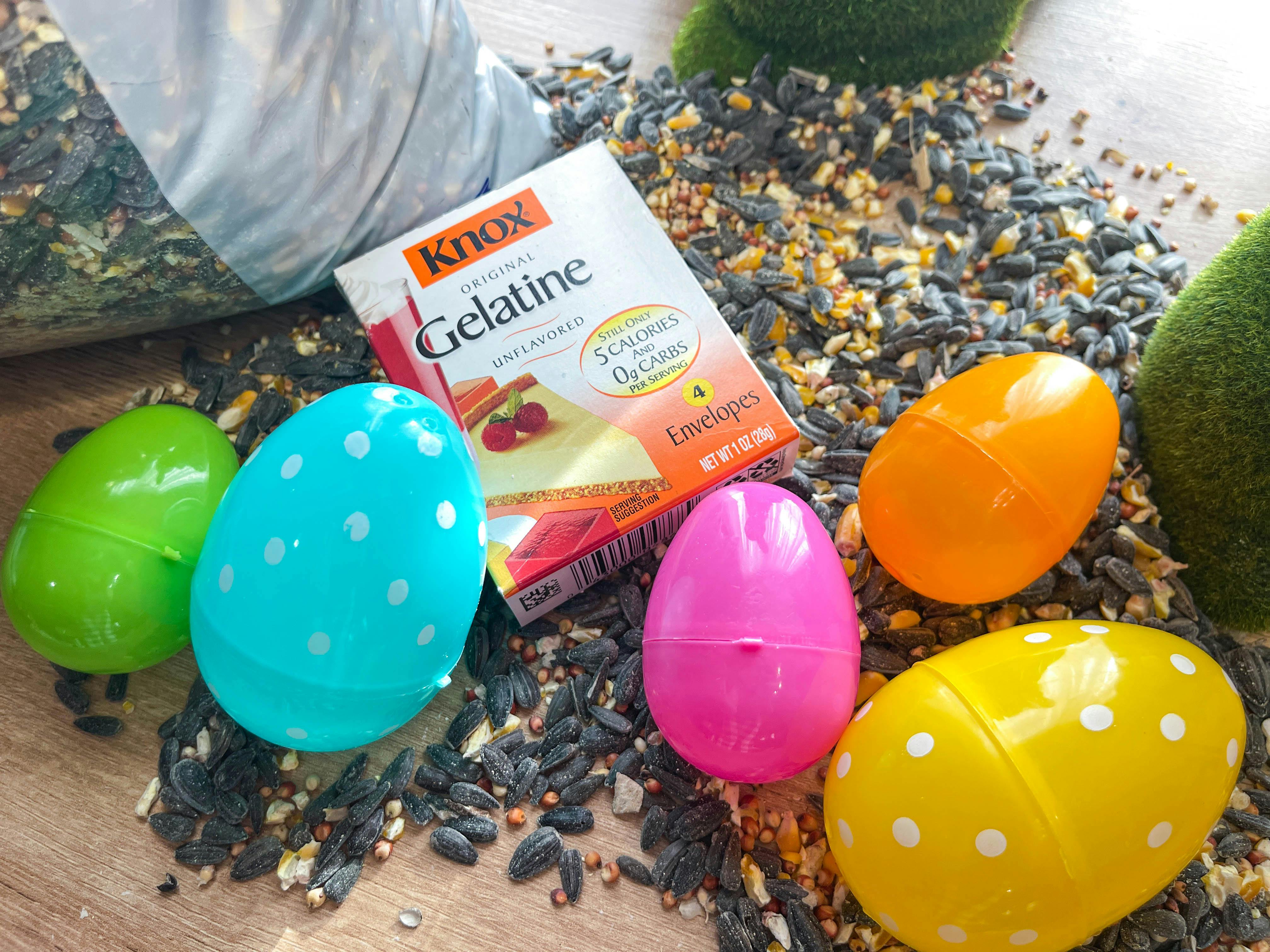 a box of gelatin plastic easter eggs and birdseed